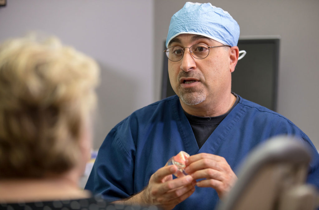 dr-ghazi-discussing-full-arch-dental-implants-with-patient – Advanced ...